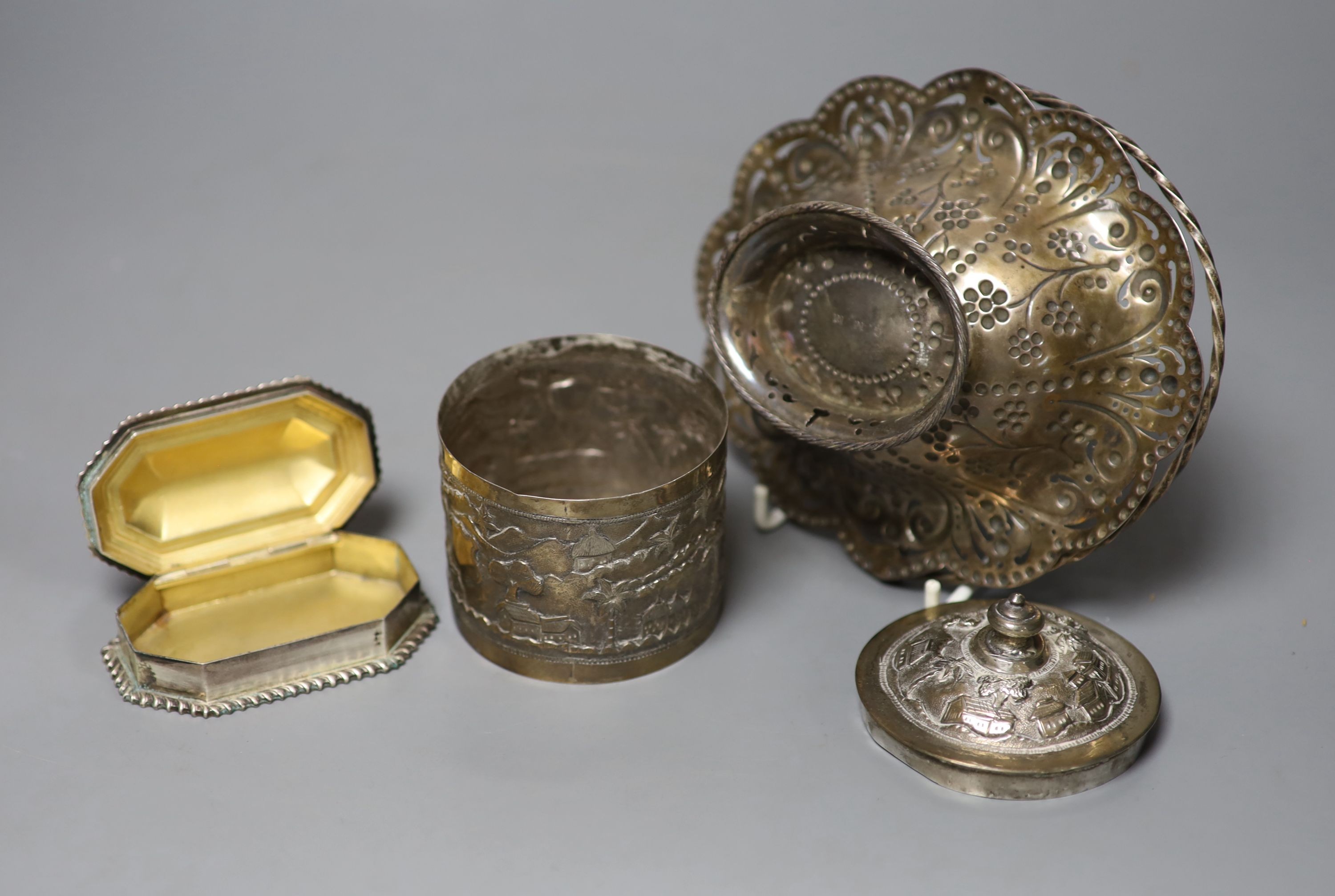 A late Victorian pierced silver basket, London, 1882, 15.7cm, a similar silver octagonal box and an Indian white metal box and cover.